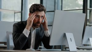 Caucasian bearded 40s middle-aged businessman worker employee man typing laptop feel failure upset with lost of information online error stressed look at computer screen suffer from headache pressure. High quality 4k footage
